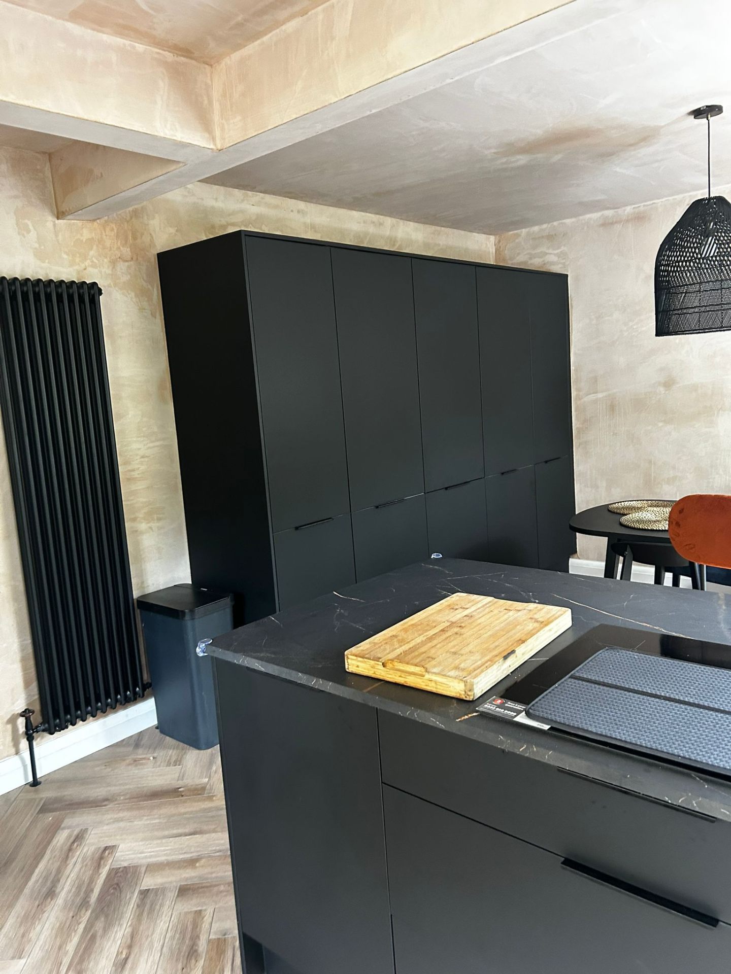 Matte black kitchen with marble island worktop in Glasgow