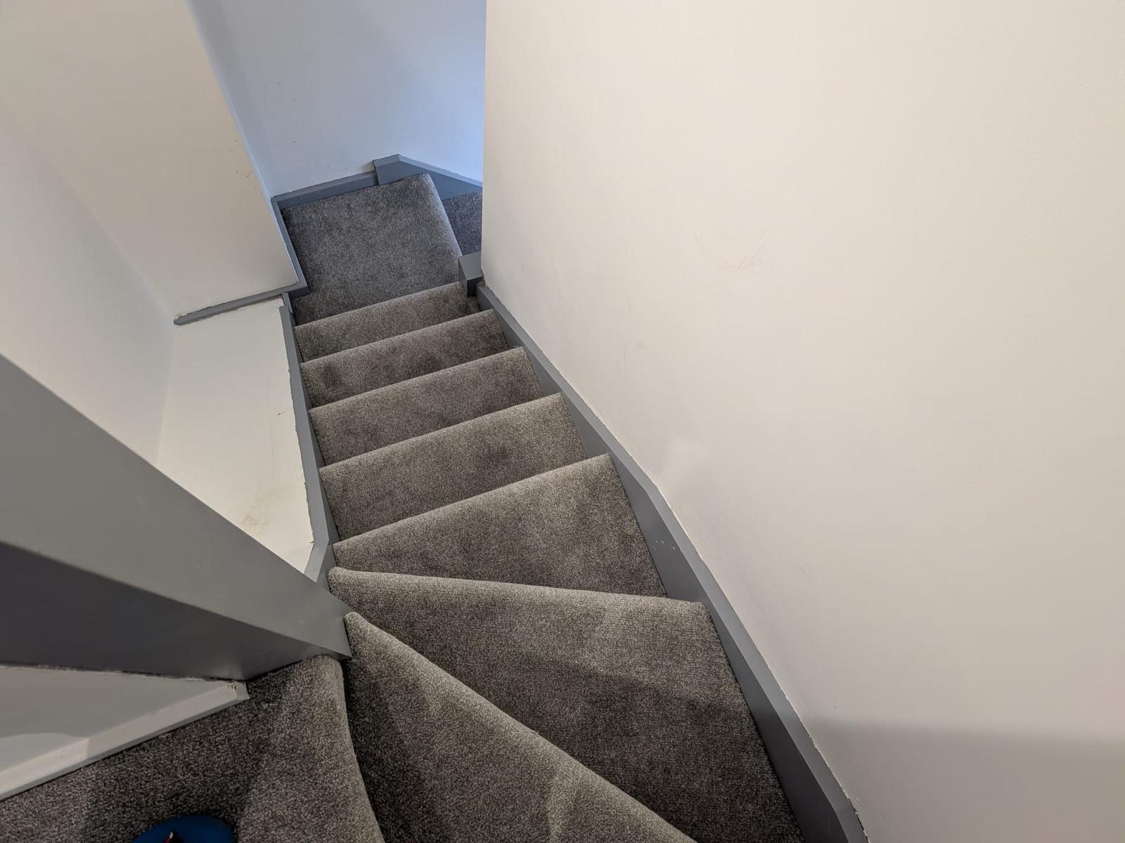 After — new carpeted staircase installed up to the converted loft