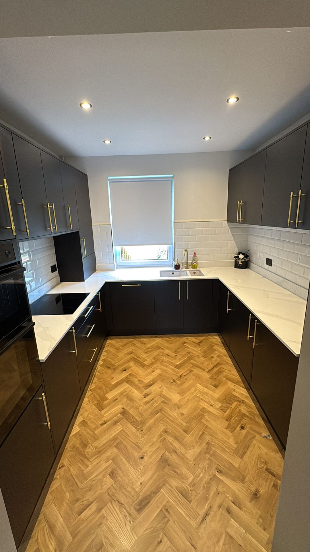Matte black kitchen with brushed gold handles installed in Glasgow